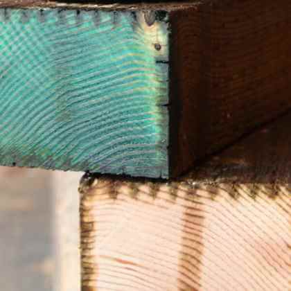 Tenino Copper Naphthenate on treated wood end-cuts pressure.
